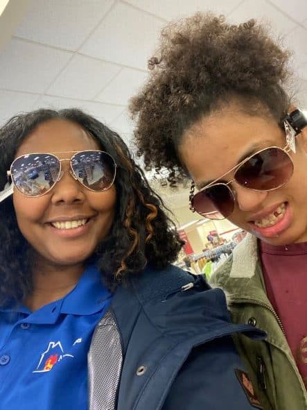 Two women wearing sunglasses.