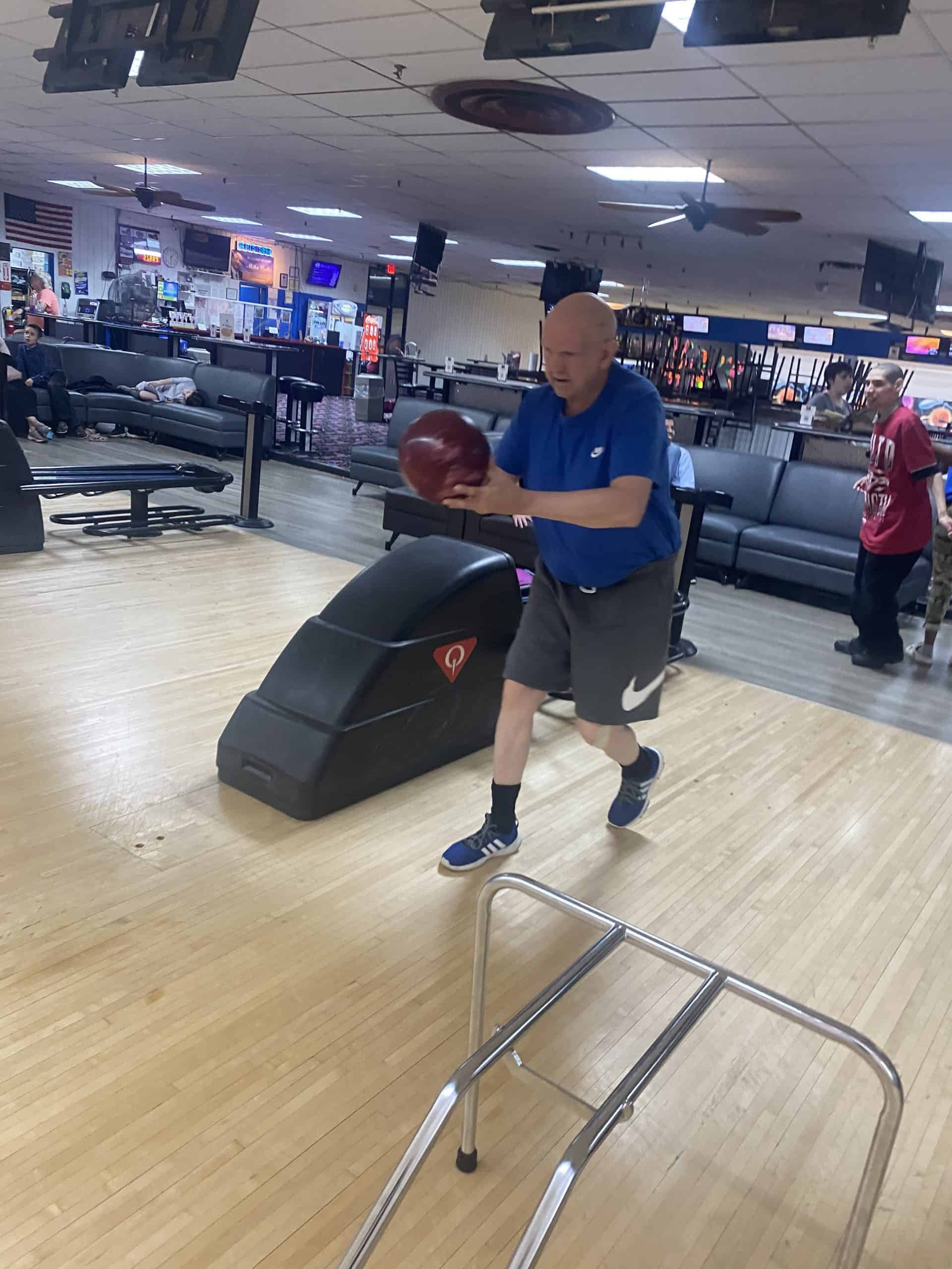 Man getting ready to throw a bowling ball.